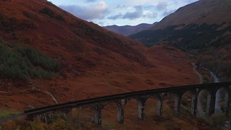 Aerial-Drone-Sunrise-pull-back-of-Glenfinnan-Viaduct