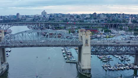 Busy-Vancouver-Bay-Skyline-Bridge-Drone-Aerial-Shot---British-Columbia,-Canada