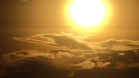 Close-up-sunrise-shot-of-the-sun-with-fast-moving-clouds