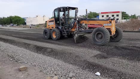 road-under-construction-with-heavy-machinery-and-workers