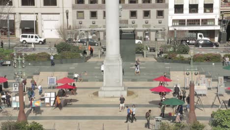 people-walking-through-busy-city,-downtown-San-Francisco-Union-Square