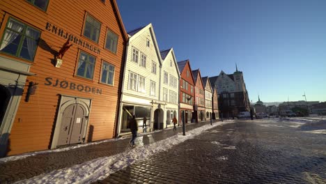 Walking-outdoors-Bryggen-Hanseatic-houses-on-beautiful-sunny-day,-Bergen-city-bryggen---Norway