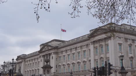 Buckingham-Palace-wide-shot-of-Union-Jack-flying-at-half-mast-to-mark-the-death-of-Prince-Philip,-Duke-of-Edinburgh,-Saturday-April-10th,-2021---London-UK