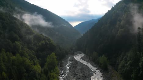 Stunning-view-of-a-small-river-between-two-green-mountains,-Spruga,-Locarno-Mountains,-Switzerland,-hiking-in-swiss-alps