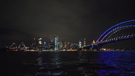 The-Sydney-Harbour-Bridge-lit-up-at-night-for-the-90th-anniversary-of-the-Australian-icon