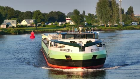 LNG-powered-tanker-ship-Ecotanker-III-on-river-in-Netherlands,-frontal-aerial