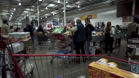 People-Queuing-With-Their-Trolleys-At-Costco-On-28-May-2022