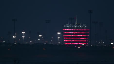 MANAMA-,-BAHRAIN---December-16:-Bahrain-International-Circuit-tower-fully-illuminated-with-national-flag-colors-displayed-on-the-occasion-of-Bahrain-National-Day