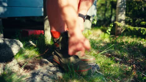 Hiker-Removing-Shoes-On-Hike-In-Indre-Fosen,-Norway---Close-Up