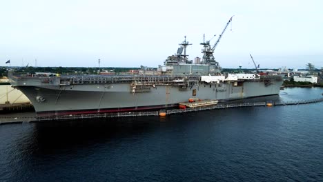 Aerial-View-Of-Aircraft-Carrier-Docked-At-General-Dynamics-Nassco-Shipyard-In-Norfolk,-Virginia