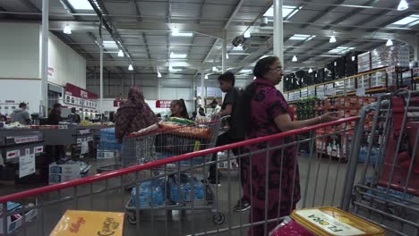 People-Queuing-With-Their-Trolleys-At-Costco-Hayes-Branch-On-28-May-2022