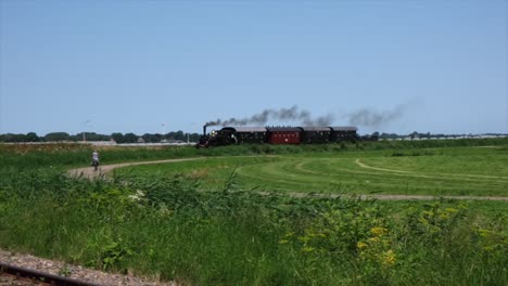 Train-travels,-unstoppable-force-driven-by-timeless-dance-of-steam-and-coal