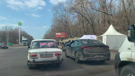 Cars-lined-up-at-a-military-checkpoint-outside-of-Lviv,-Ukraine-due-to-the-war-with-Russia