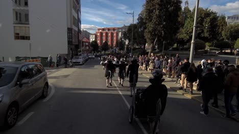 Group-Parading-Through-Street-During-Carnival-In-Ordes-To-Theme-Of-The-Falutist-of-Hemelin-In-Ordes,-Spain