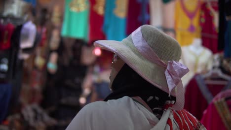 A-local-women-shopping-in-the-marchandise-of-Djerba-houmet-souk