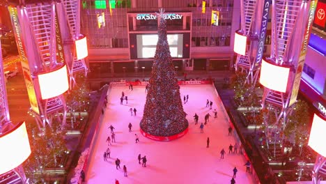 Ice-Skating-Ring-|-Downtown-Los-Angeles-|-Xbox-Plaza-|-LA-Live-|-Christmas-Tree-|-Night-time-|-Camera-Moving-Away