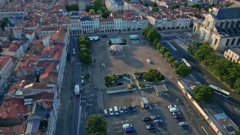 Forward-aerial-movement-above-the-Place-de-Verdun-with-La-Rochelle-Cathedral,-La-Rochelle,-France