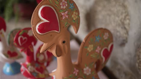 Barcelos-rooster-figurine-with-heart-and-floral-designs,-symbolizing-Portuguese-folklore