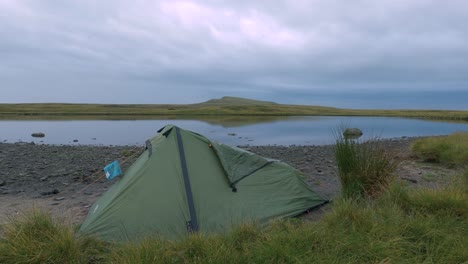 Tent-camping-near-North-Yorkshire-Whernside-tarn-in-England,-United-Kingdom