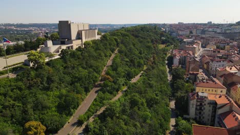 Aerial-footage-of-Prague-capturing-Žižkov-Hill,-historic-buildings,-and-city-landmarks,-showcasing-Prague's-unique-blend-of-architecture-and-scenic-beauty