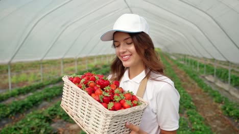 Woman-in-special-clothes-holding-basket-with-strawberries.