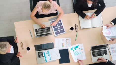 Business-people-group-meeting-shot-from-top-view