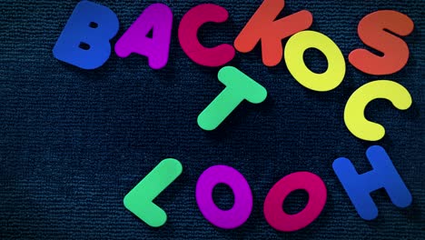 Back-to-school-sign-written-with-colored-letters,-on-a-stop-motion-video