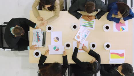 Business-people-group-meeting-shot-from-top-view