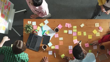 Top-view-of-skilled-business-people-discuss-plan-at-meeting-room.-Convocation.