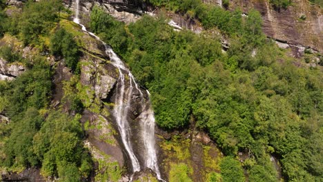 Drone-Descends-to-Reveal-Picturesque-Waterfalls-in-Scenic-Mountain-Destination