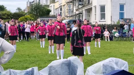 Welsh-dance-troop-performing-baton-formation-routine-at-Holyhead-seaside-festival-with-audience