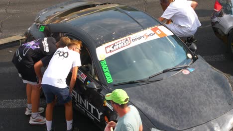 Fans-checking-race-car-inside-during-the-car-exhibition