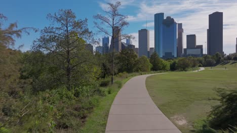 Walking-on-a-trail-in-Eleanor-Tinsley-Park-in-Houston,-TX