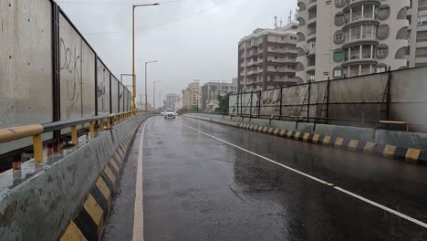 Vehicular-traffic-is-visible-on-the-over-bridge-in-the-ongoing-rain