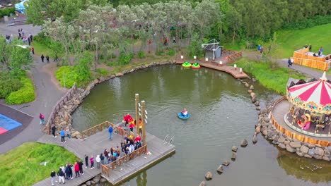 Aerial-view-of-kids-having-fun-at-outdoor-adventure-and-amusement-park