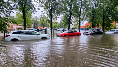 Flooded-street-and-cars-in-residential-area-of-Jelgava-Latvia,-overflooded