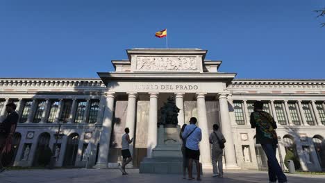 Facade-of-El-Prado-Museum-in-Madrid-City,-Spain,-with-a-statue-of-Velazquez-in-front