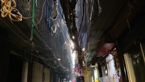 Old-alleys-with-people-walking-and-visiting-tea-stall-in-Puran-Dhaka,-very-thin-and-small-path-in-Bangladesh