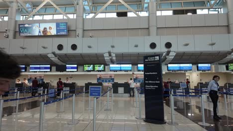 Open-luggage-drop-check-in-desks-of-the-Copa-Airlines-and-Air-France-airline-companies-at-Juan-Santamaria-International-Airport,-San-Jose,-Costa-Rica