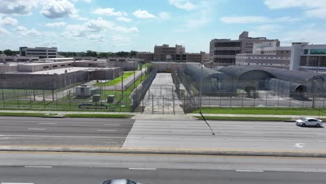 High-security-detention-facility-in-Orlando-is-surrounded-by-multiple-layers-of-fencing-and-secure-gates