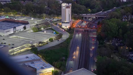 Close-up-view-of-SR-400-traffic-from-a-penthouse-balcony-in-Buckhead-Atlanta,-Georgia