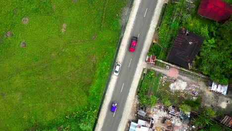 Aerial-Ascend-Above-Busy-Street-In-Manuel-Philippines-On-Sunny-Day