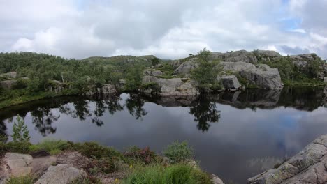 Water-pond-at-high-altitude-during-trek-hike-in-Norway,-nature-trail