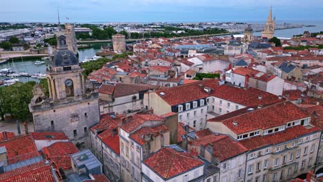 Backward-aerial-movement-about-the-Big-Clock-aka-Grosse-Horloge-at-old-port,-La-Rochelle,-France