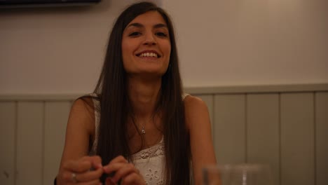 Portrait-shot-of-a-caucasian-woman-with-long-brown-hair-happy-smiling