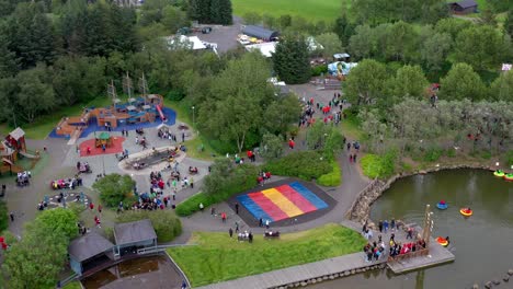 Drone-shot-of-adventure-rides-at-amusement-park-and-zoo-in-urban-residential-neighborhood