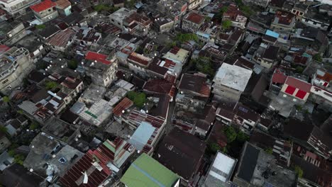 Aerial-view-of-the-dense-cityscape-rooftops-in-Moroni,-Comoros,-showcasing-the-urban-architecture-and-vibrant-community-from-above