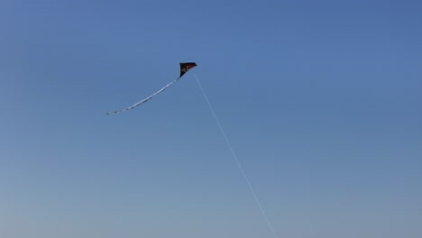 Drone,aerial-Kite-flying-blue-sky-background-Pann-down-to-string