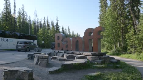 Banff-city-sign-in-Alberta,-Canada-side-of-the-road-entrance,-mountain-town