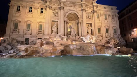 Majestic-tilt-up-view-of-Trevi-Fountain-at-dawn,-Rome,-Italy-before-sunset